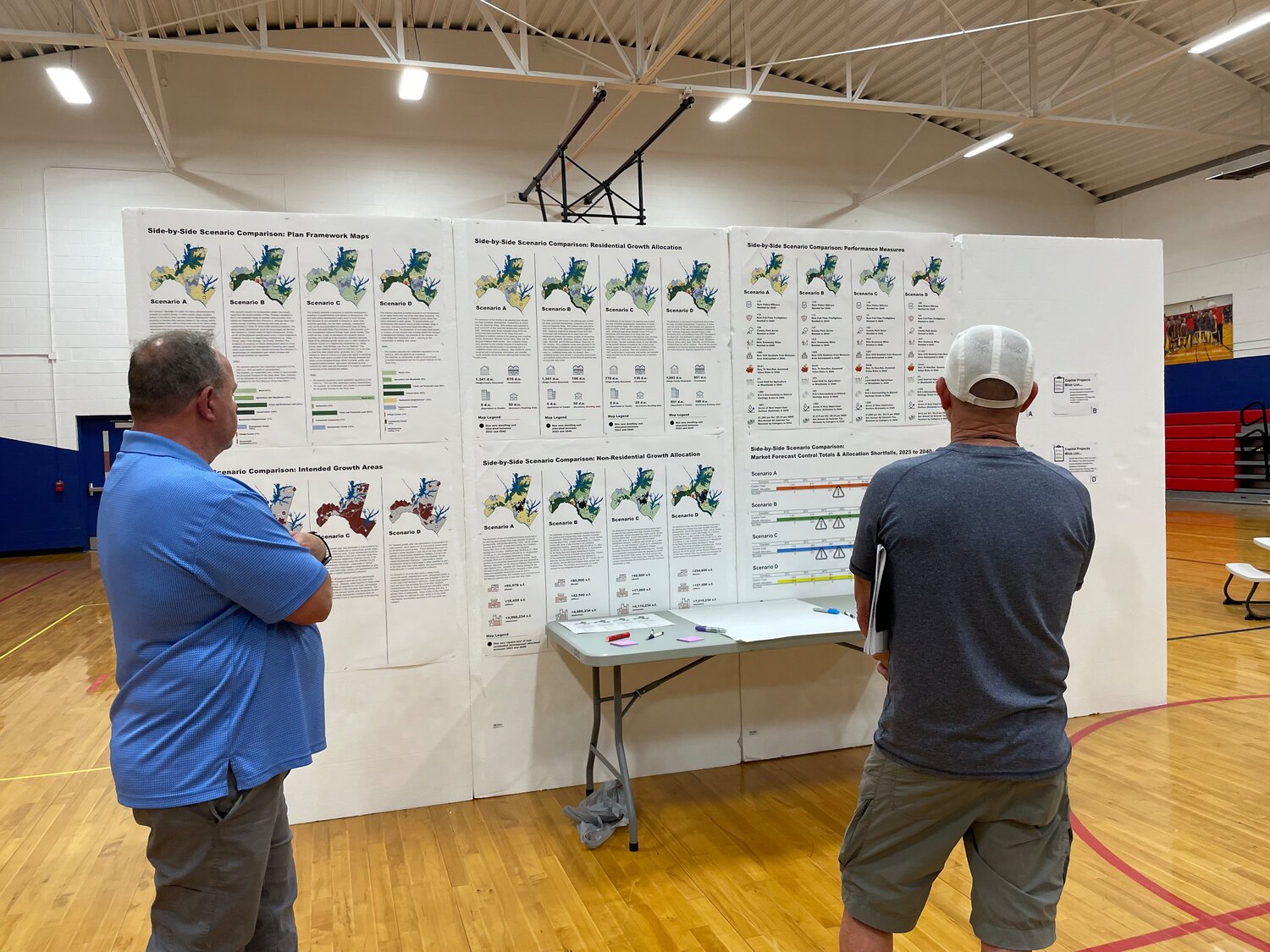 Moncure residents examine different scenario plans for the future of their community at a Plan Moncure meeting last Wednesday.